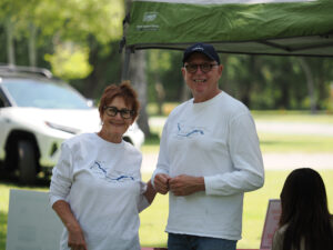 Leanne and ARPF Office Manager Tom volunteering at an event